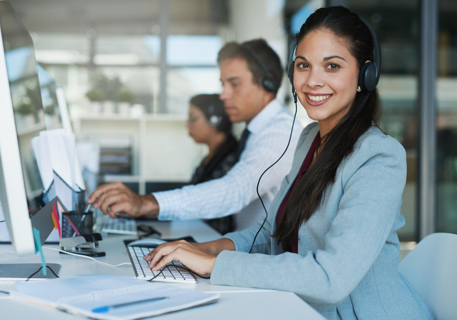 happy-hear-from-you-portrait-happy-confident-young-woman-working-call-center.jpg